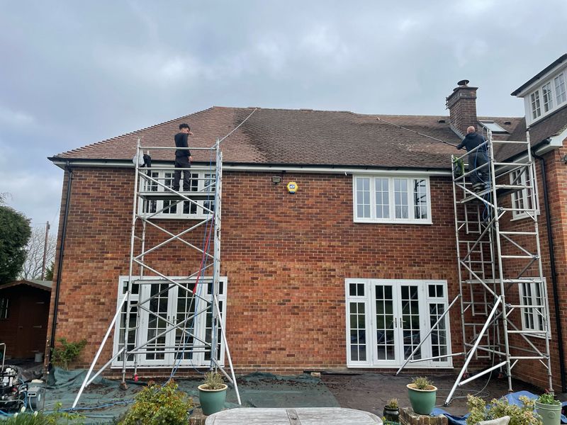 Roof cleaning carried out safely from scaffold towers by The Roof Moss Cleaners in Stroud